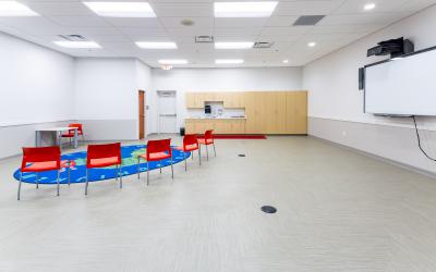 Chairs, rug and Smartboard inside meeting room