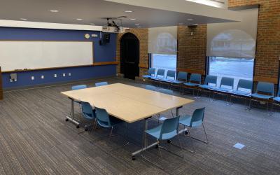 Table and chairs set up in Owl Meeting Room