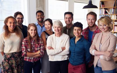 A group of students standing around a teacher