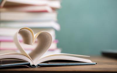 Open book with pages forming a heart