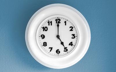Clock displaying five o'clock