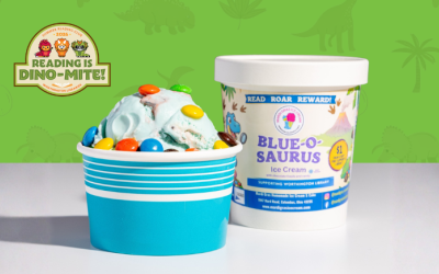 Cup of blue ice cream with candies next to a pint of Blue-o-saurus ice cream from Mardi Gras Homemade Ice Cream in front of the summer reading club logo.