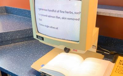 Book text enlarged on closed circuit magnifier