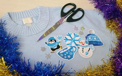 Sweater, scissors and winter-themed decorations