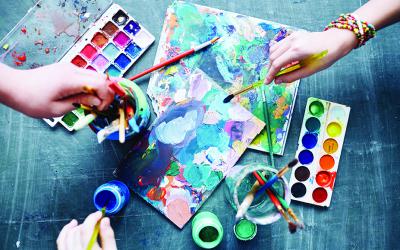 The art process with canvases, brushes and paints