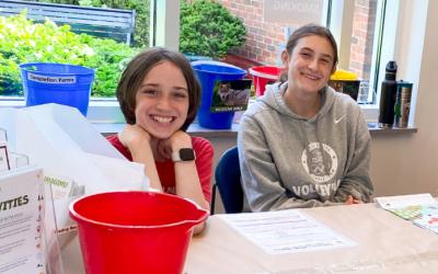 Volunteens at summer reading club table