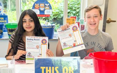 Volunteens at summer reading club table