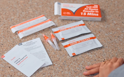 Contents of COVID-19 test kit spread out on kitchen counter