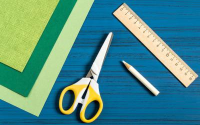 Scissors, a pencil, a ruler and construction paper