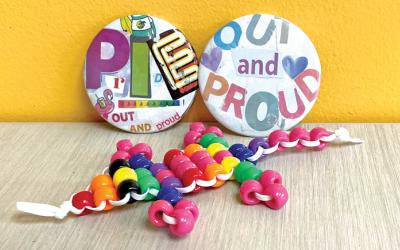 Pride-themed keychain and buttons