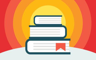 A stack of books with a red bookmark