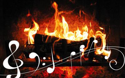 Musical scale and a log burning in a fireplace