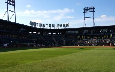 Green grass of Huntington Park baseball field with stands
