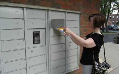 Woman using the pick-up lockers at Old Worthington Library