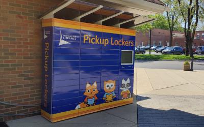 Pickup lockers with animal mascots outside Old Worthington south entrance 