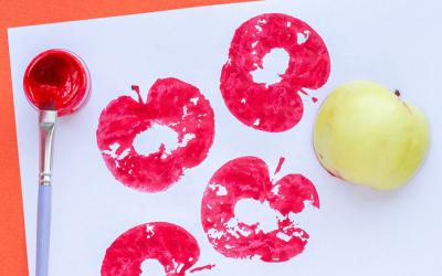 Paint, paintbrush and apple
