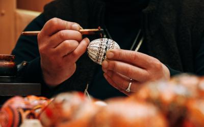 Female hands painting eggs