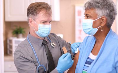 Healthcare worker completing an injection