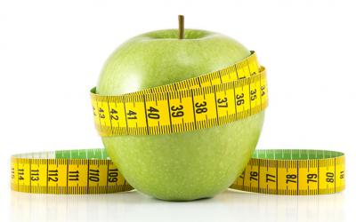 Apple wrapped in measuring tape
