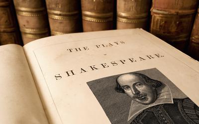 Open book with engraving of Shakespeare