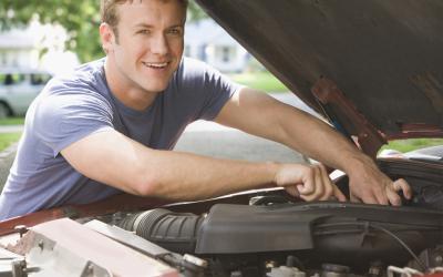 Man working on car engine