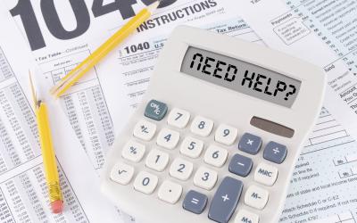 1040 tax form with broken pencil and calculator reading Need Help?